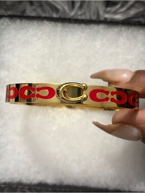 Coach Gold-Tone Cuff Bracelet with Red Signature Motif